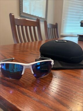 Oakley White Frame Sunglasses with Blue Mirrored Lenses